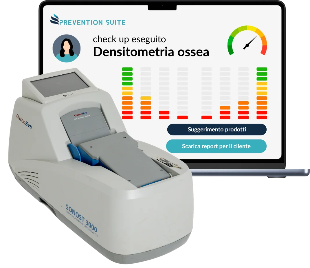 Densitometro osseo e referto della densitometria su laptop